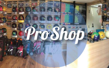 A bowling pro shop filled with colorful bowling balls on shelves and a blue circle labeled Pro Shop.