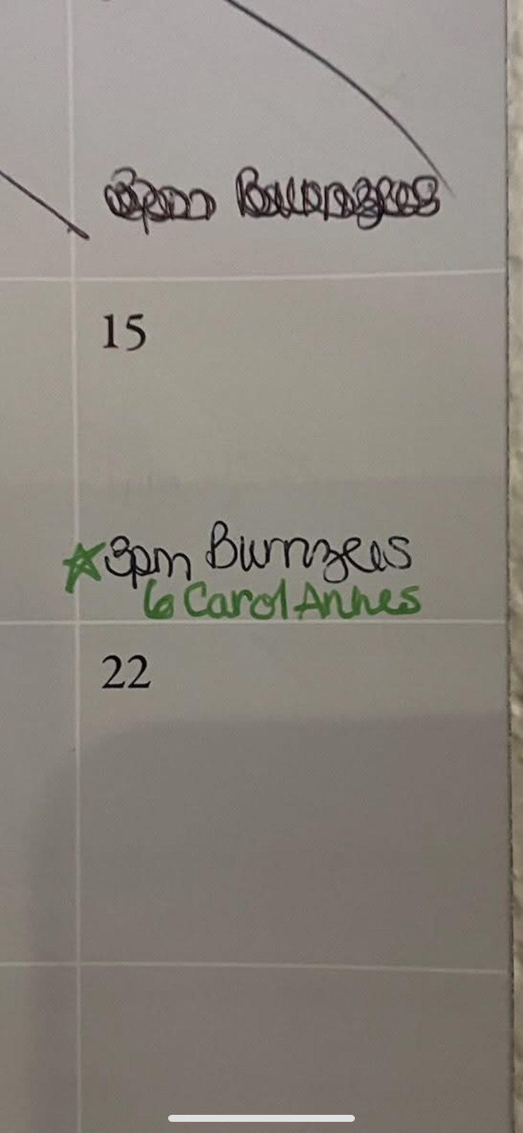 A close-up photo of a calendar showing handwritten notes for the 15th and 22nd, with "Open bowling" and "3pm Bowlers" noted.