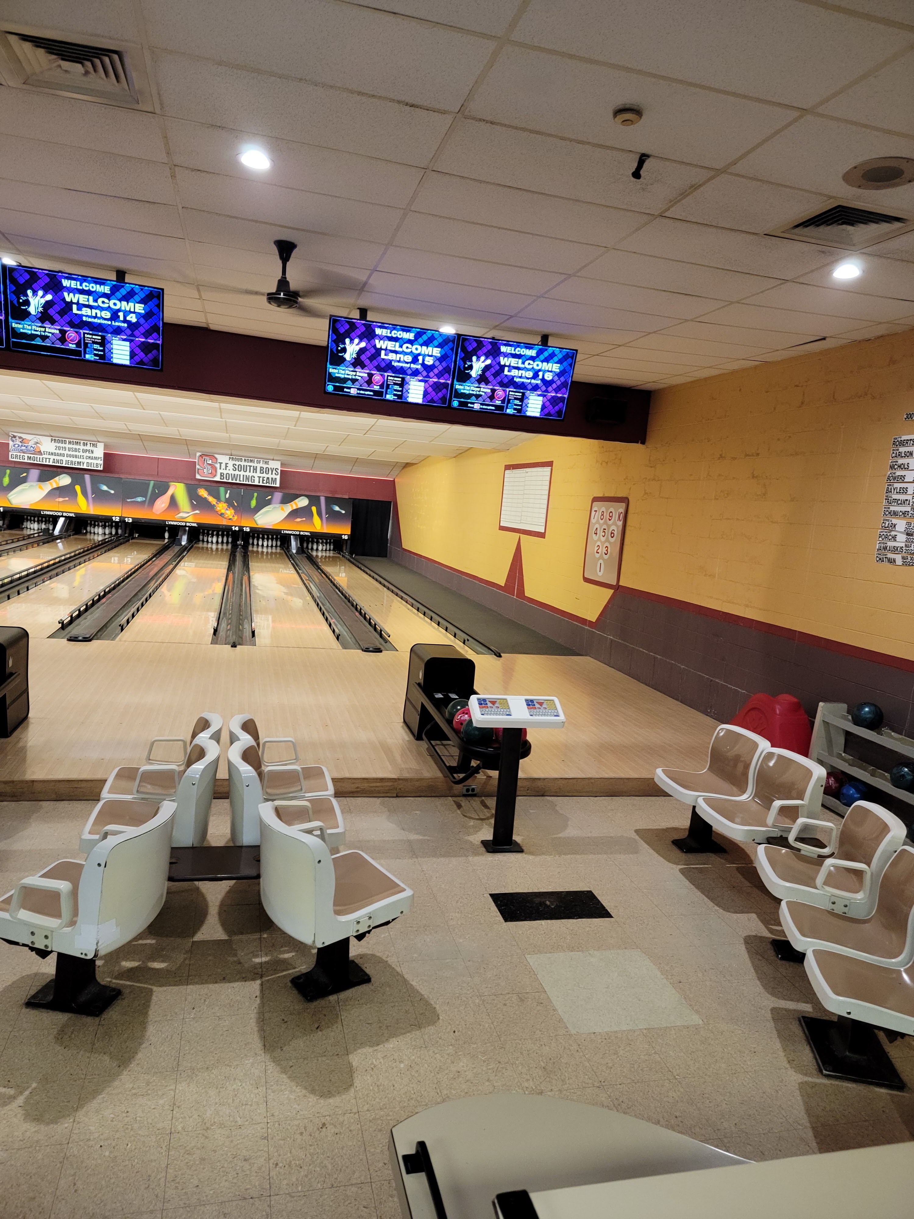 Lanes 14 through 16 at Lynwood Bowl featuring digital scoring monitors and vintage-style seating.