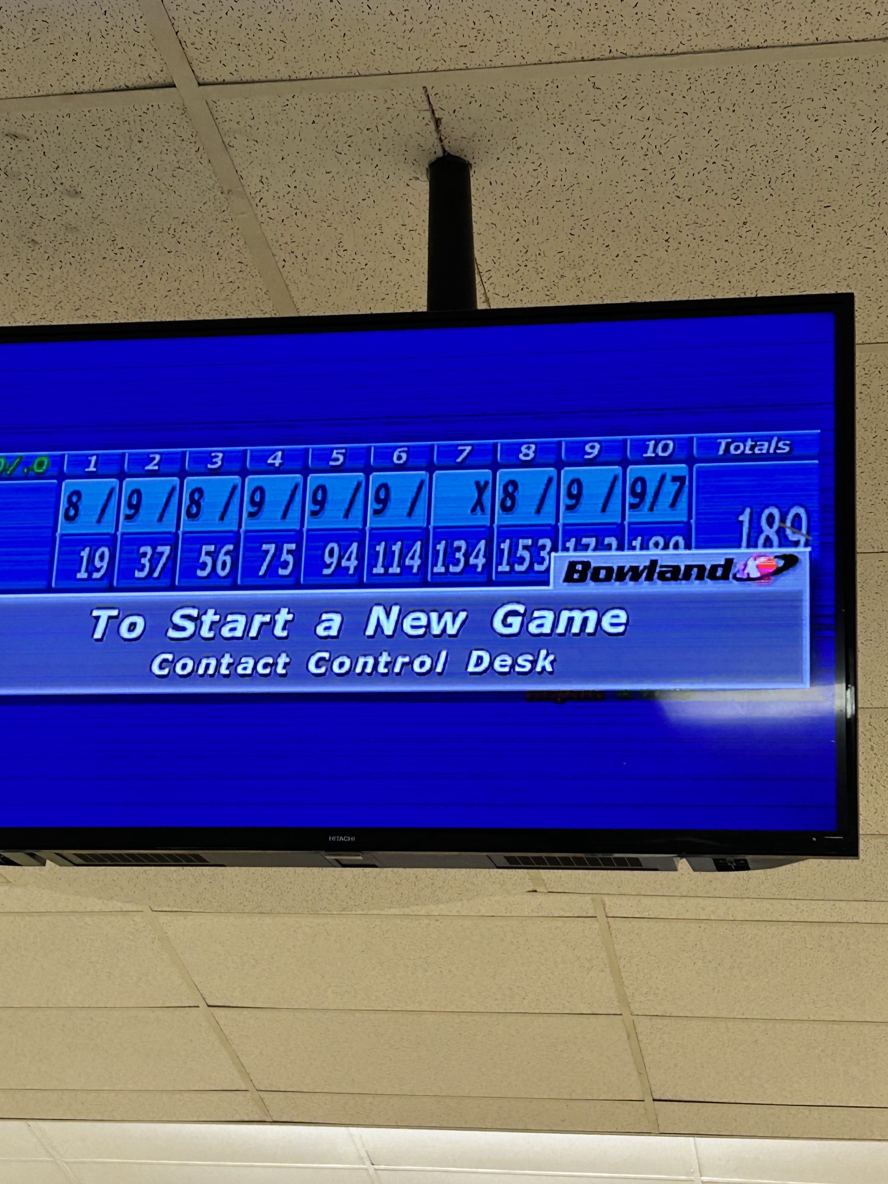 Close-up of an overhead bowling monitor showing a final score of 189 with several spares and a strike.