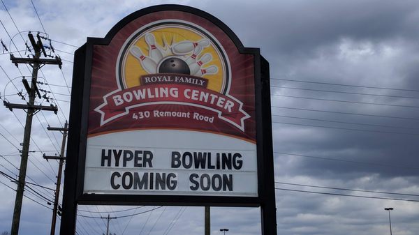 Roadside marquee sign for Royal Family Bowling Center with a reader board announcing Hyper Bowling coming soon.