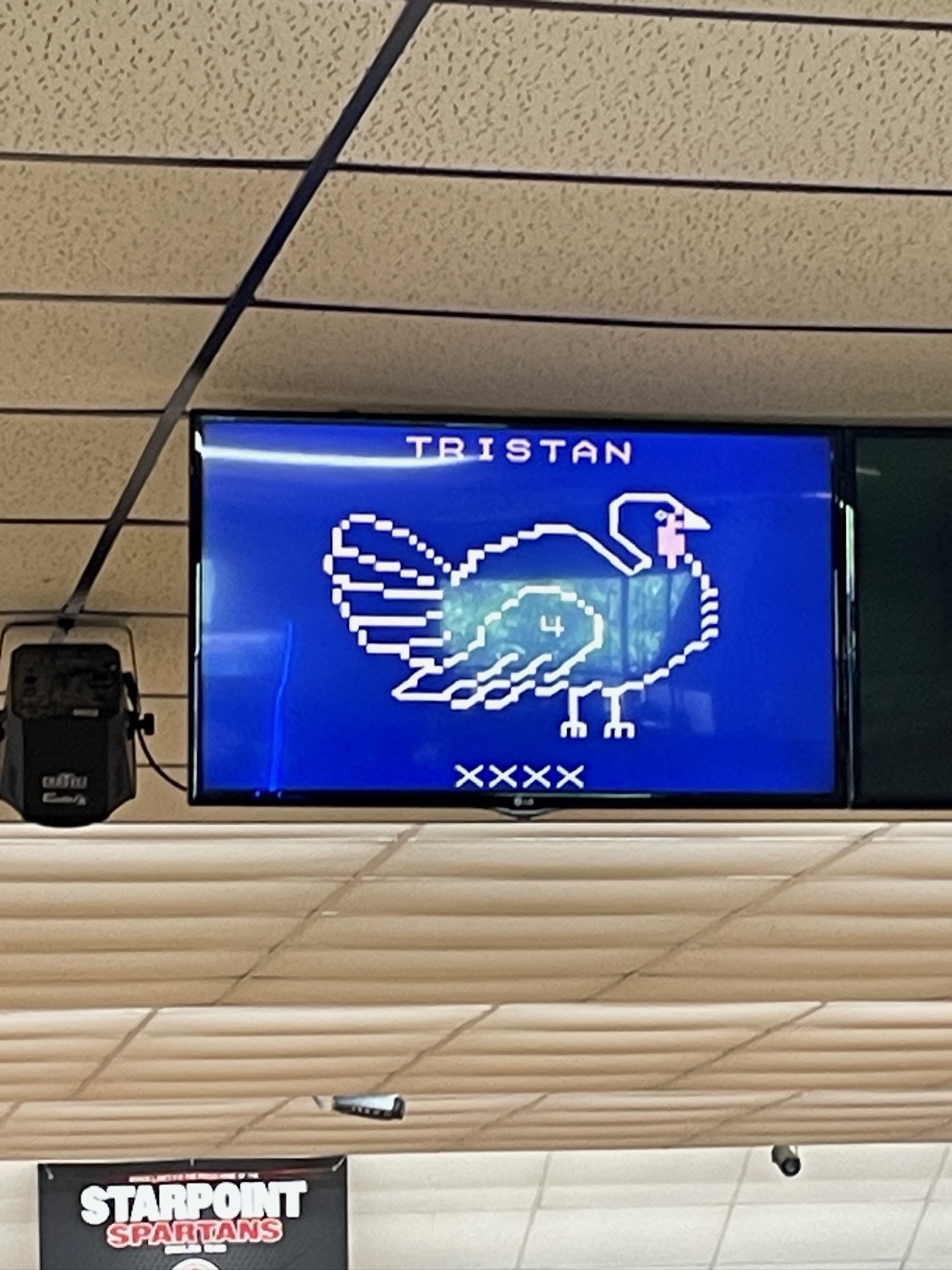 An overhead bowling monitor shows a pixel-art turkey animation for a player with four consecutive strikes.