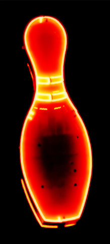 A glowing red and yellow neon bowling pin set against a solid black background.